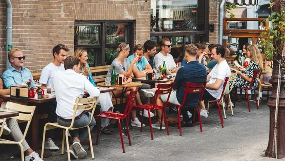 People having drinks on the terrace of Bonnie café-bar.