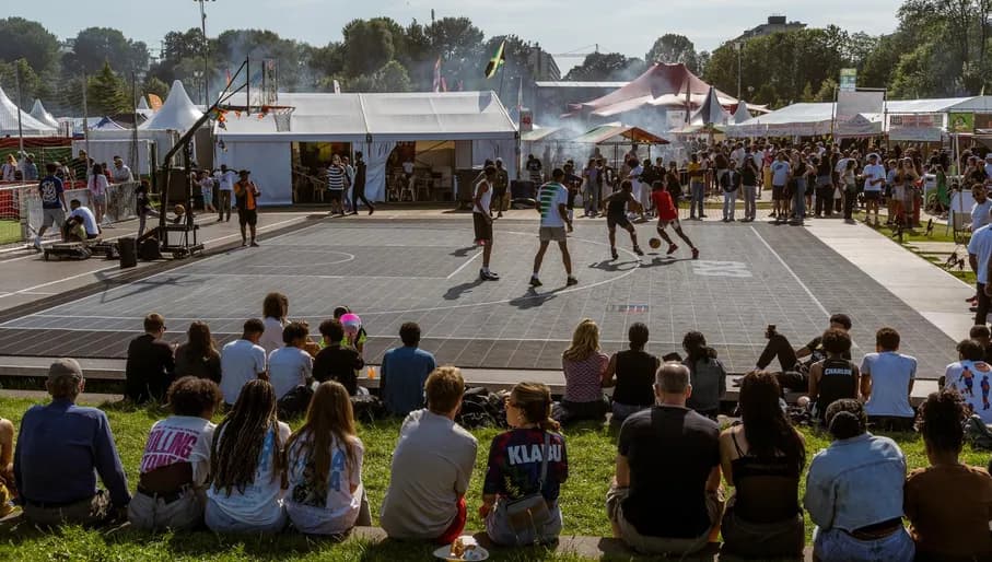 People and Kids playing football at Kwaku Summer Festival