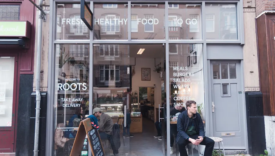 man sitting Outside Hotspot Roots