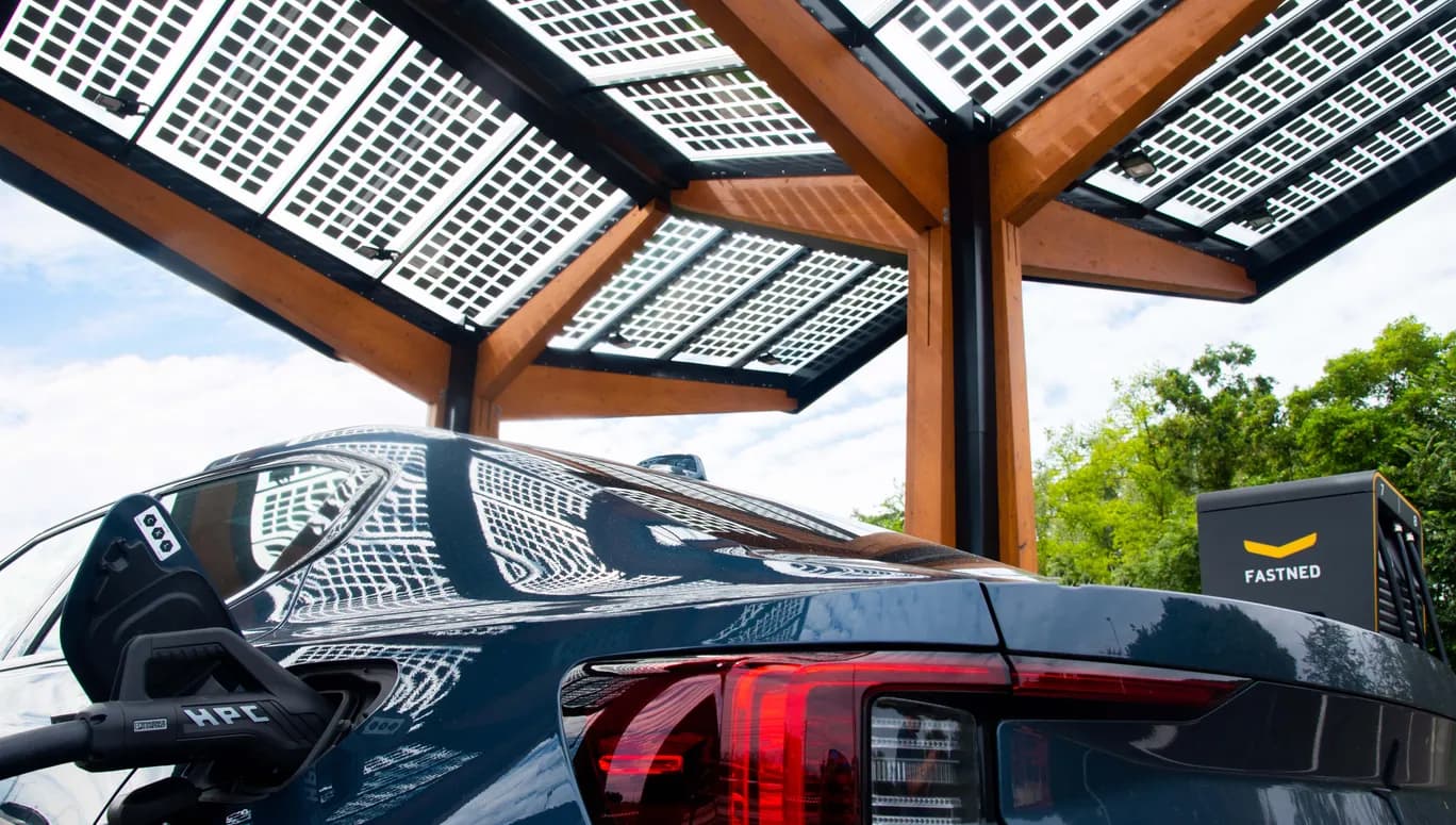 Black car charging at a smart charging point