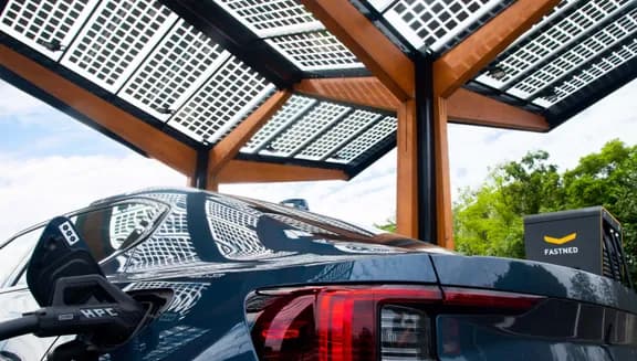 Black car charging at a smart charging point