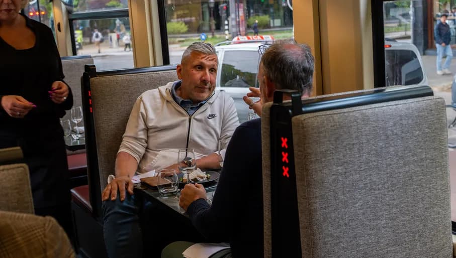 Couple dining on Amstertram moving restaurant