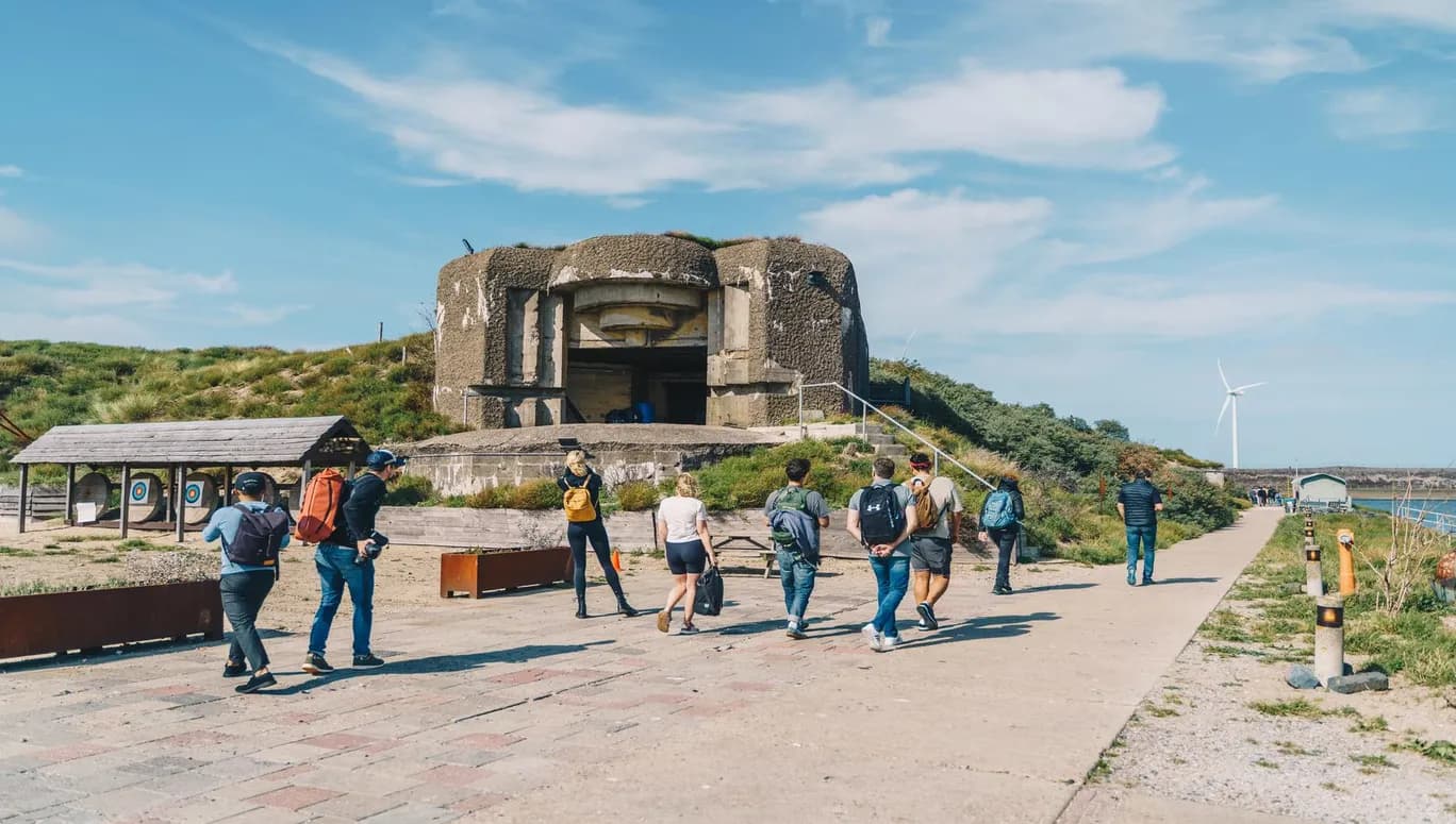 People walking at the Amsterdam Beach Forteiland Ijmuiden -Bunker