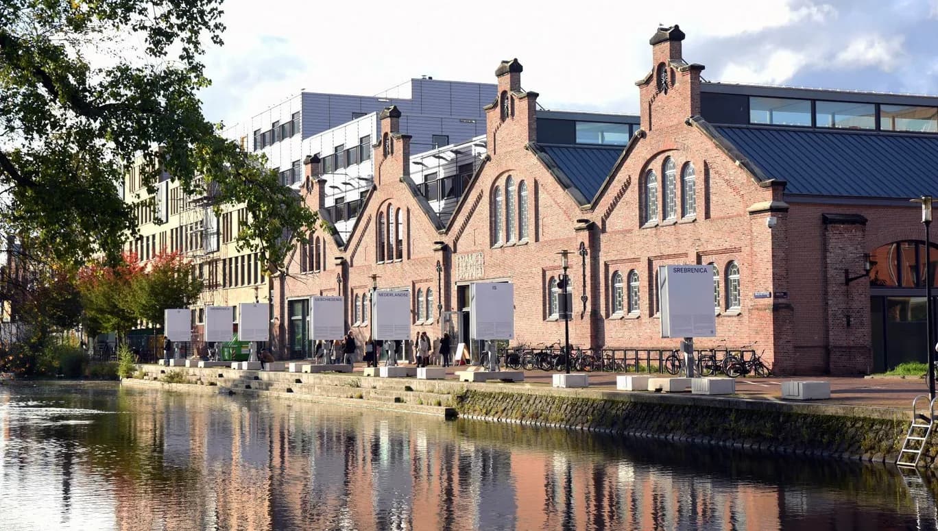 Framer Framed gallery front view with outdoor exhibition along the canal
