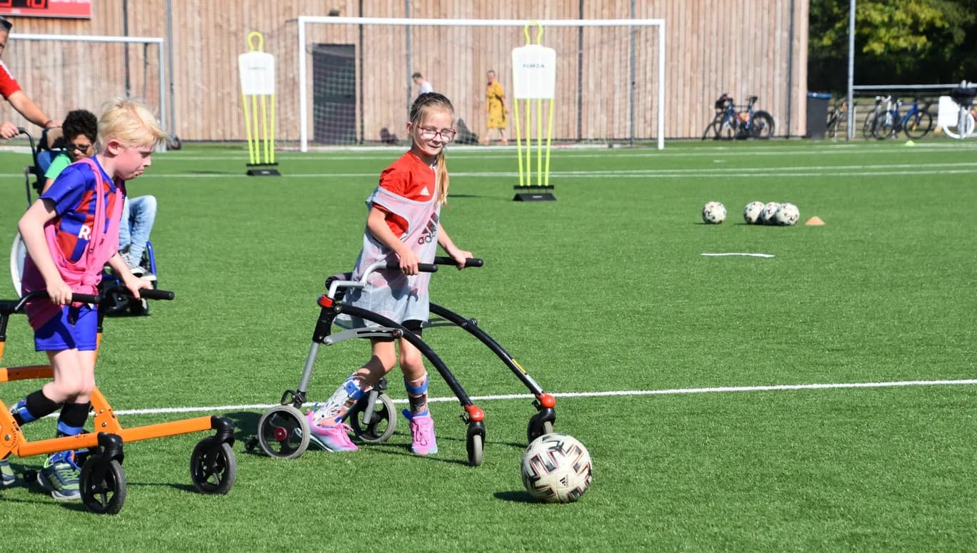 Only Friends disabled kids playing football outside