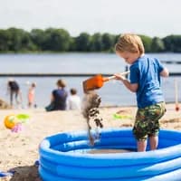 Beach Sloterplas, child playing on the beach