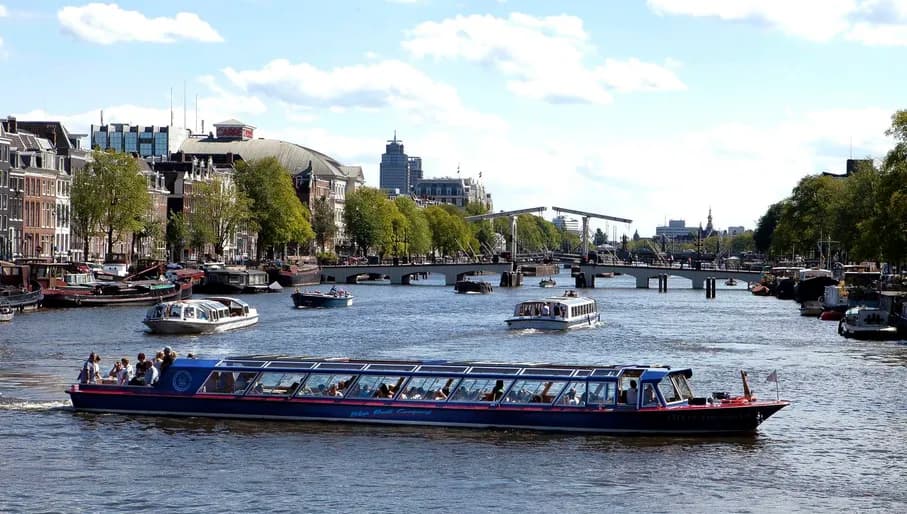 Blue Boat Company canal cruise on the Amstel river with the Magere Brug