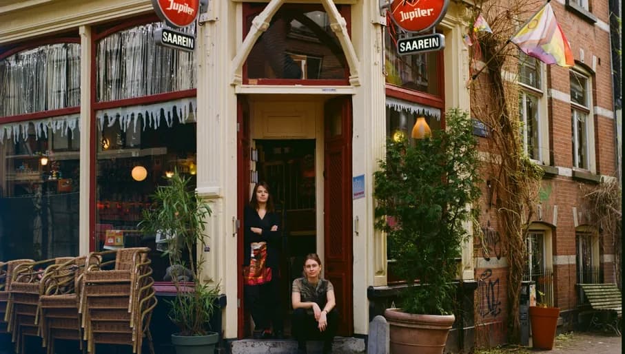 Café Saarein exterior with the two owners sitting in the entrance