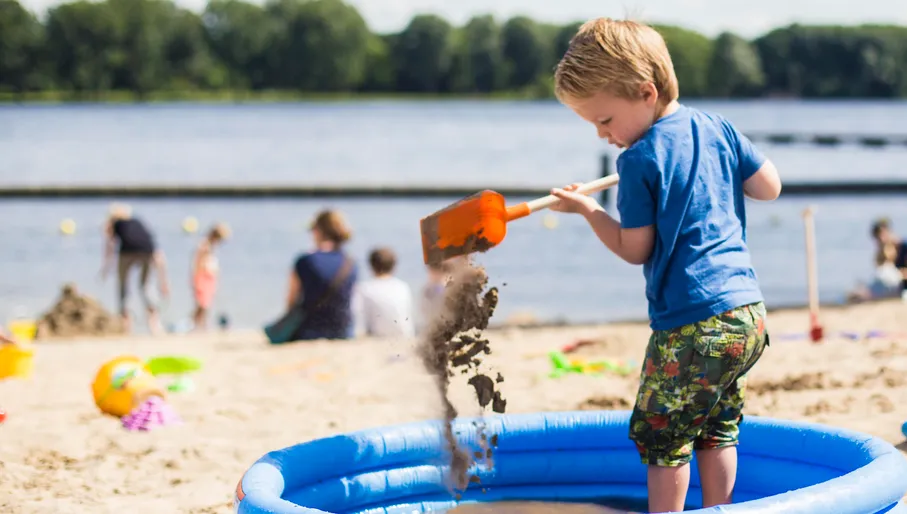 Beach Sloterplas, child playing on the beach