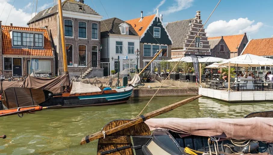Fischers boat in the canal in the city of Monnickendam.