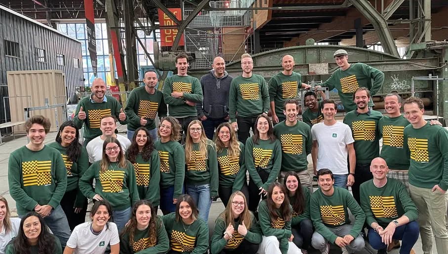 Amberscript team with matching Amberscript sweaters and T-shirts.