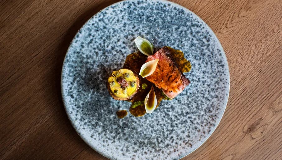 A plate of Holstein chuck steak with BBQ leek at Vermeer Michelin star restaurant