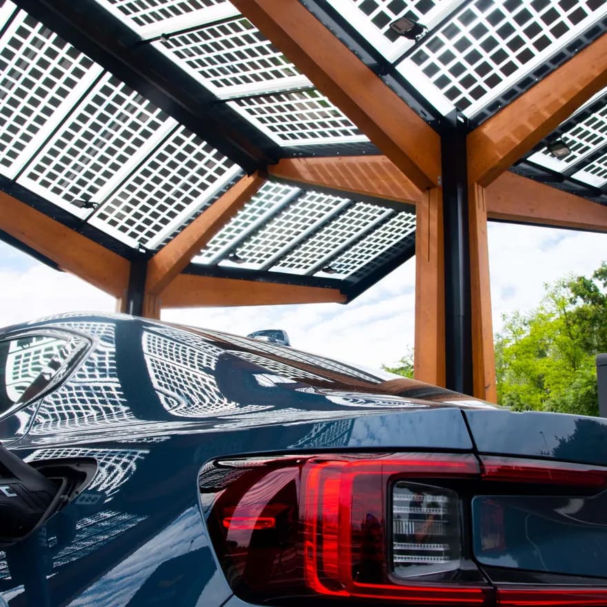 Black car charging at a smart charging point